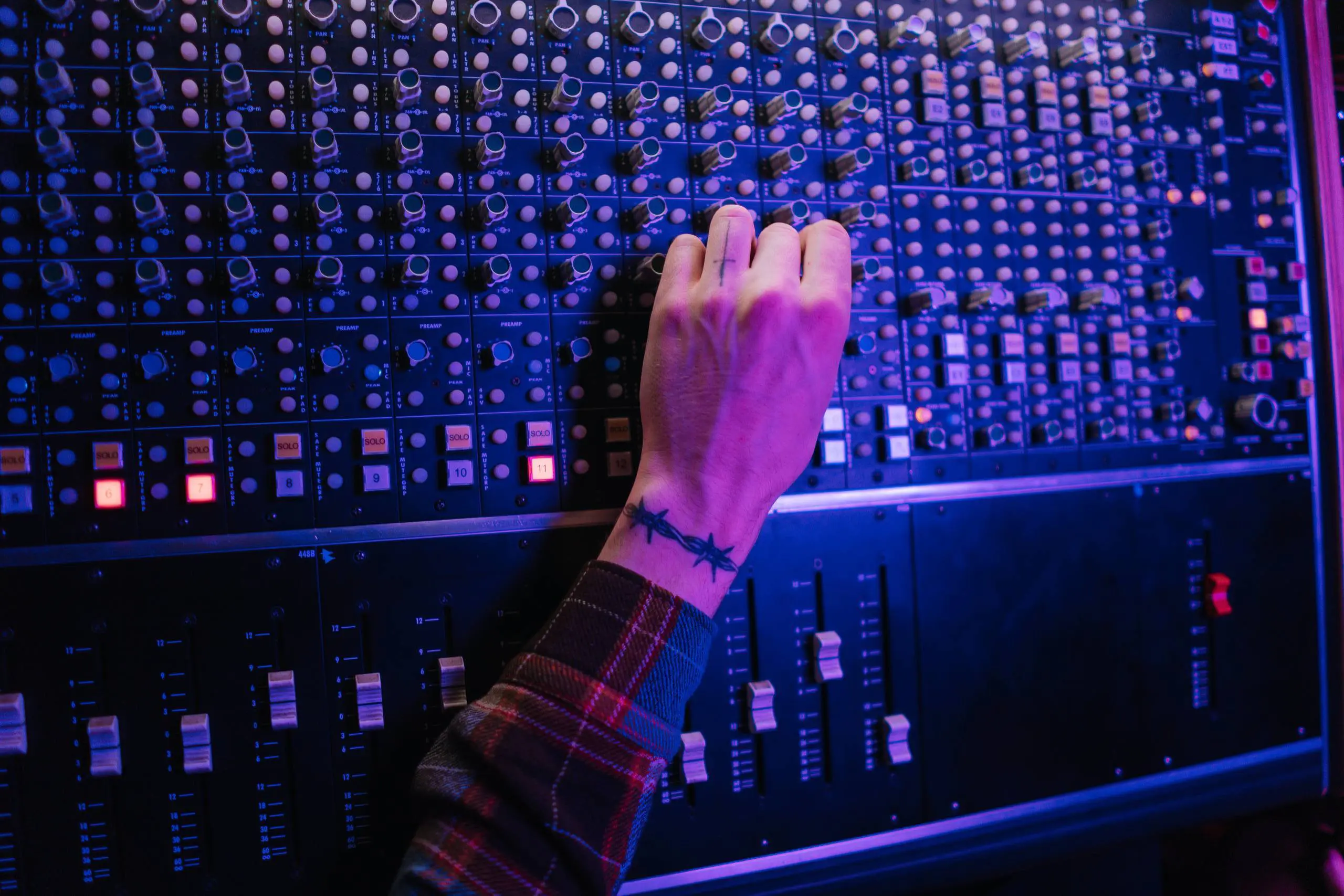 Hand on a mixing board